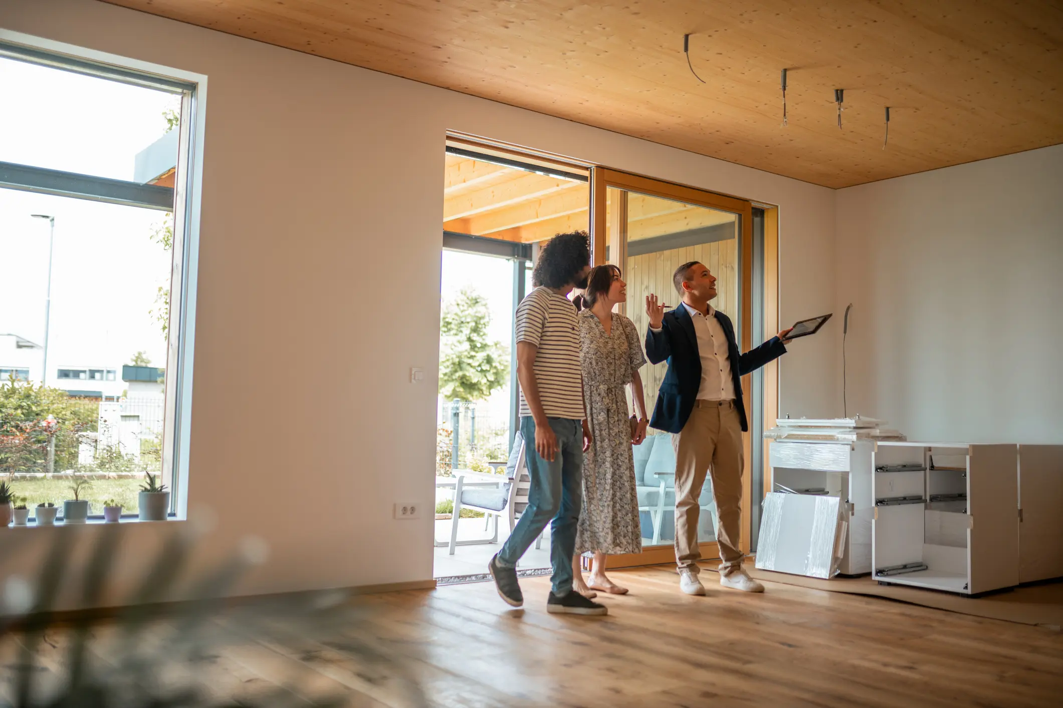 A couple celebrates in their new home with a high five.